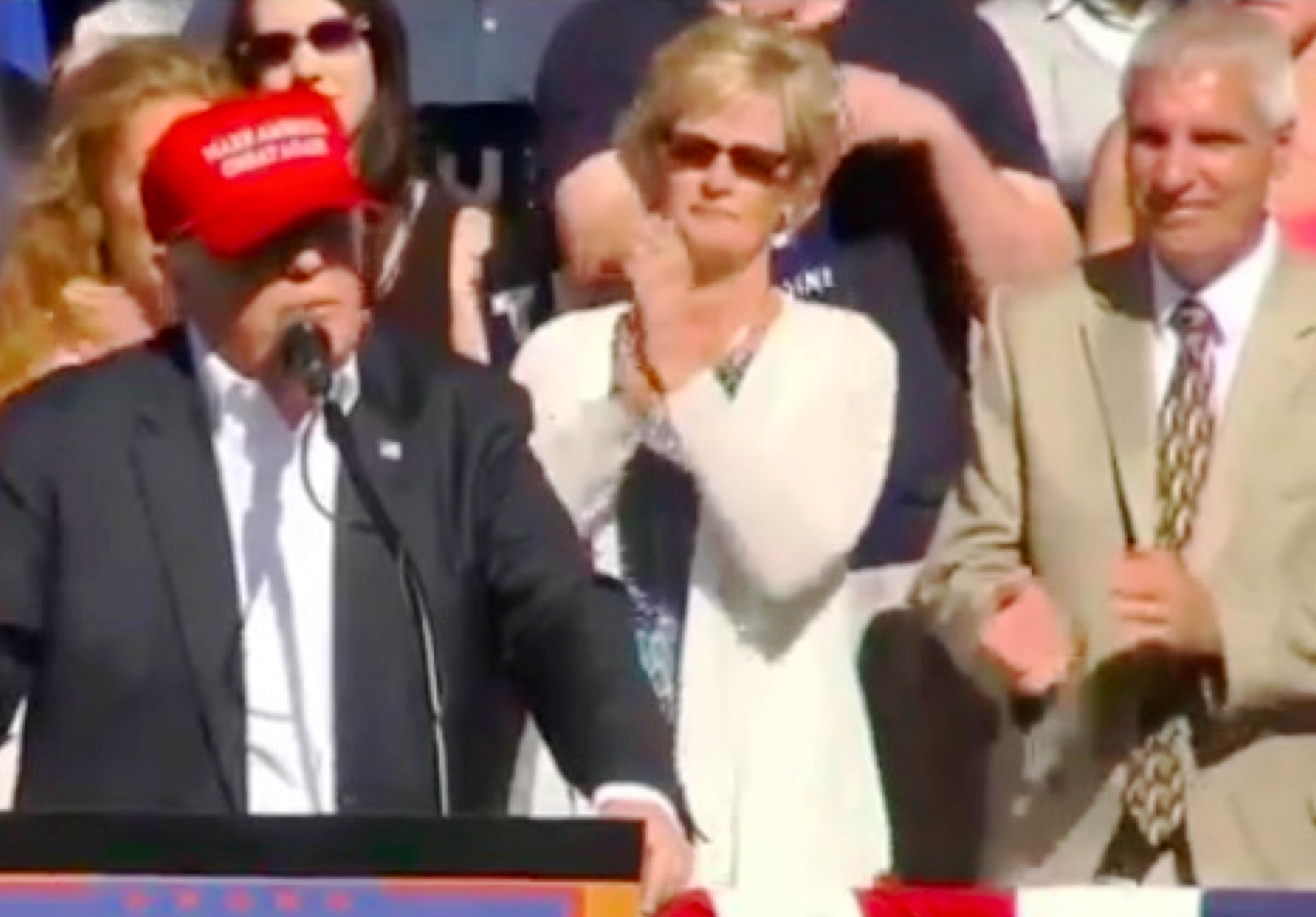 Donald Trump speaking, Lynden Mayor Scott Korthuis on the right and his wife between them. (from YouTube video of rally, ref. 15)