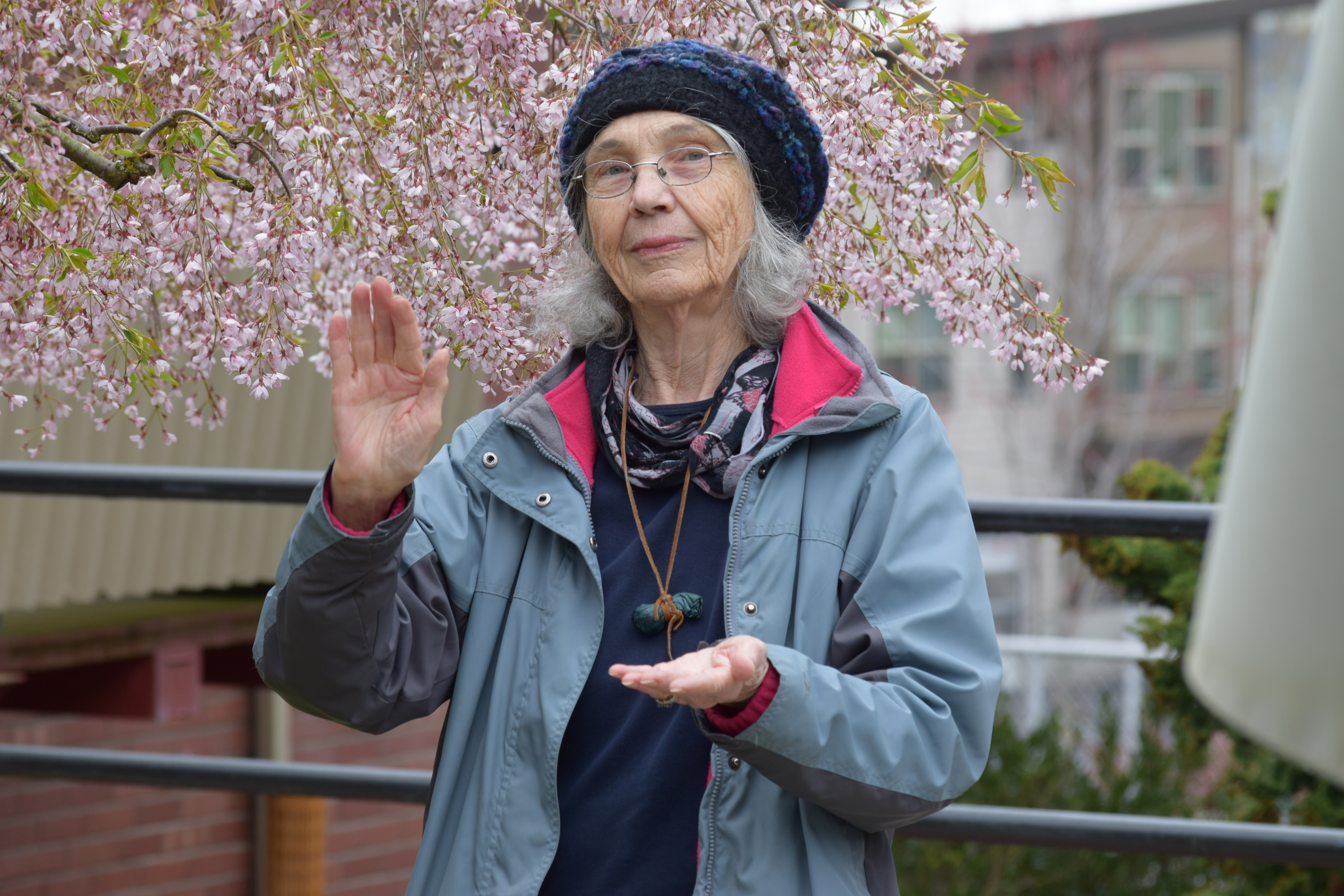 Ellen Murphy illustrating the two hands of nonviolence. photo: C.J. Pace